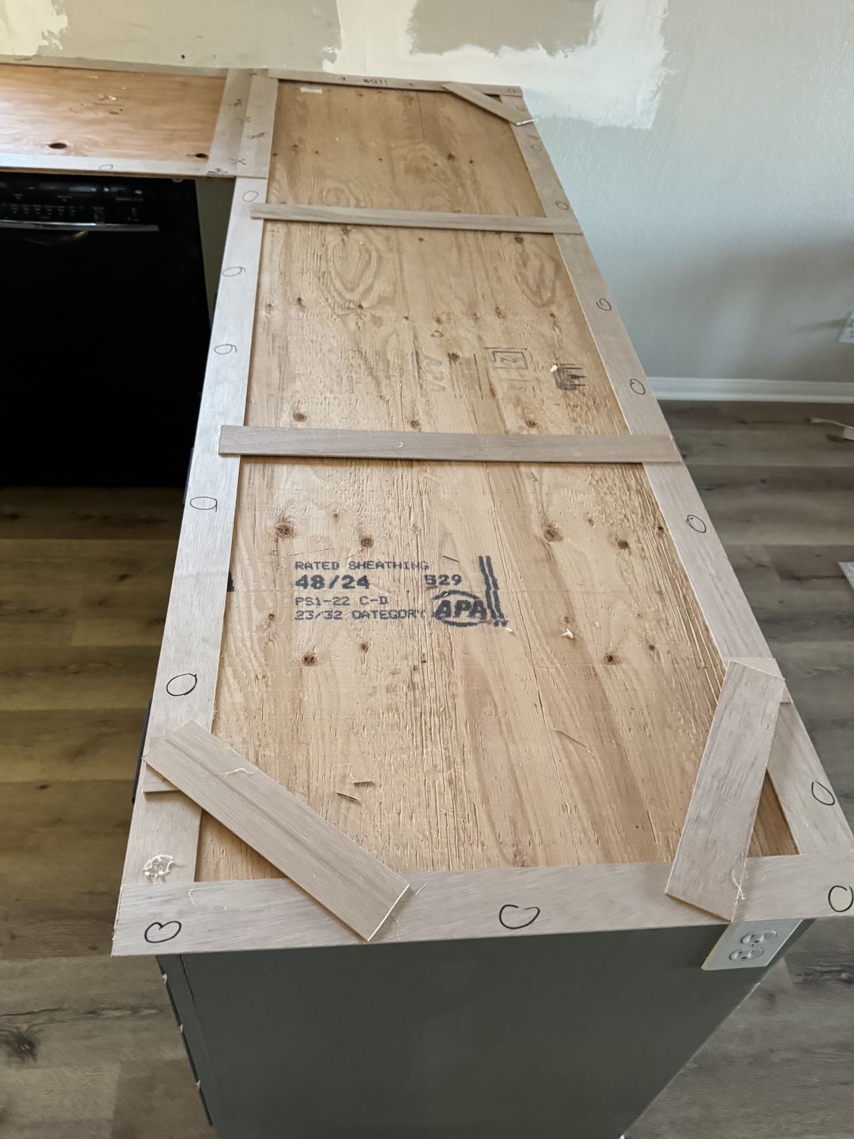 Wood-strip template built on the cabinets — countertop fabrication process
